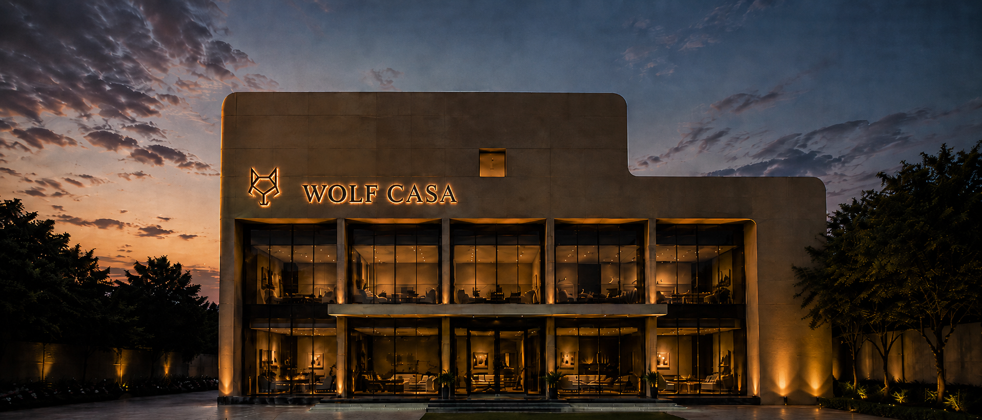 The Wolf Casa showroom on Dewas Bypass Road, Indore, at dusk with the signage lit